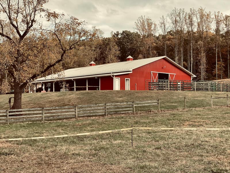 A red and white barn on the fairgrounds